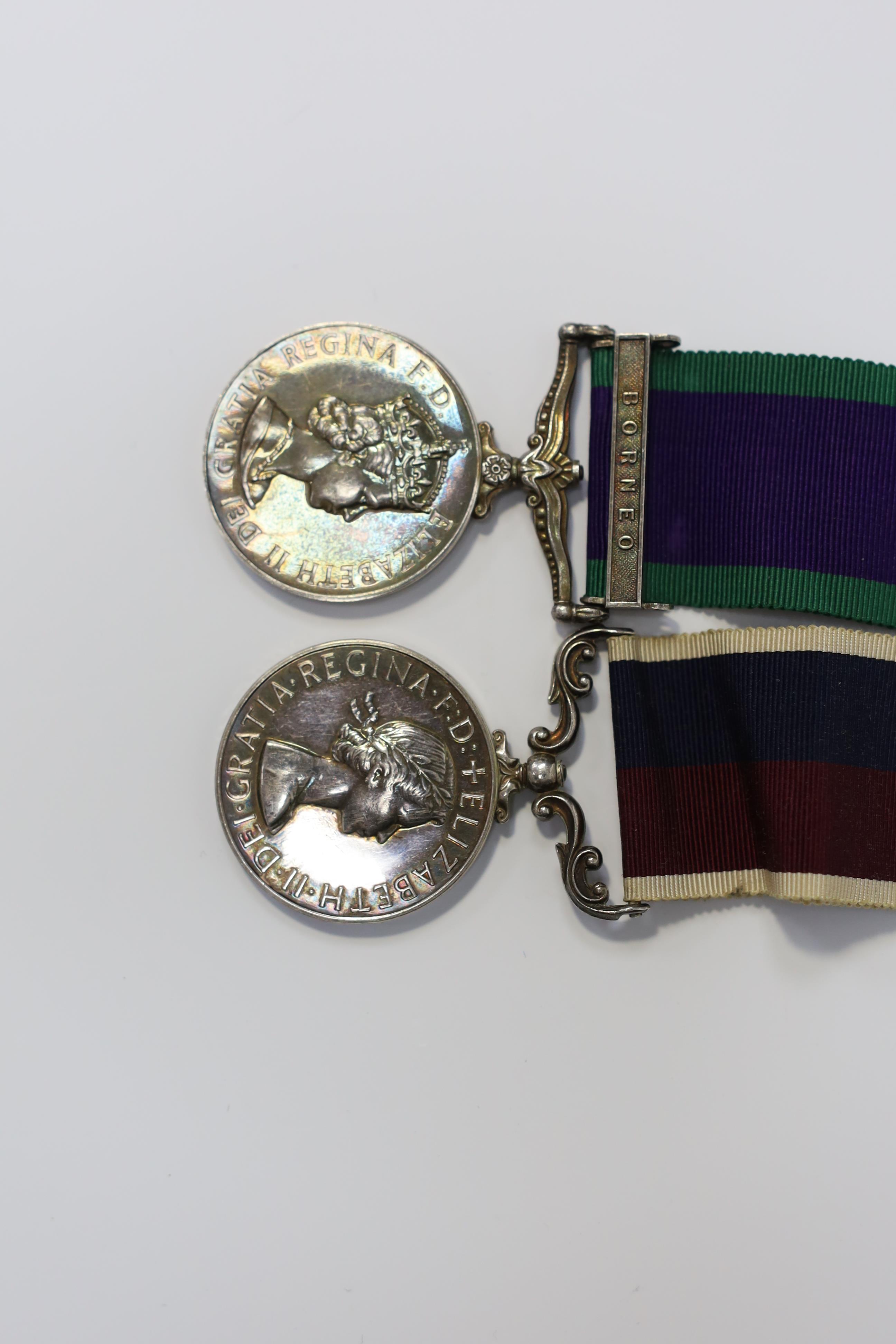 An ERII RAF medal pair awarded to Cpl. A.F.G. Pitcher RAF, comprising; a General Service Medal with a bar for Borneo and an RAF Long Service Medal, mounted on a common pin. Condition - fair to good